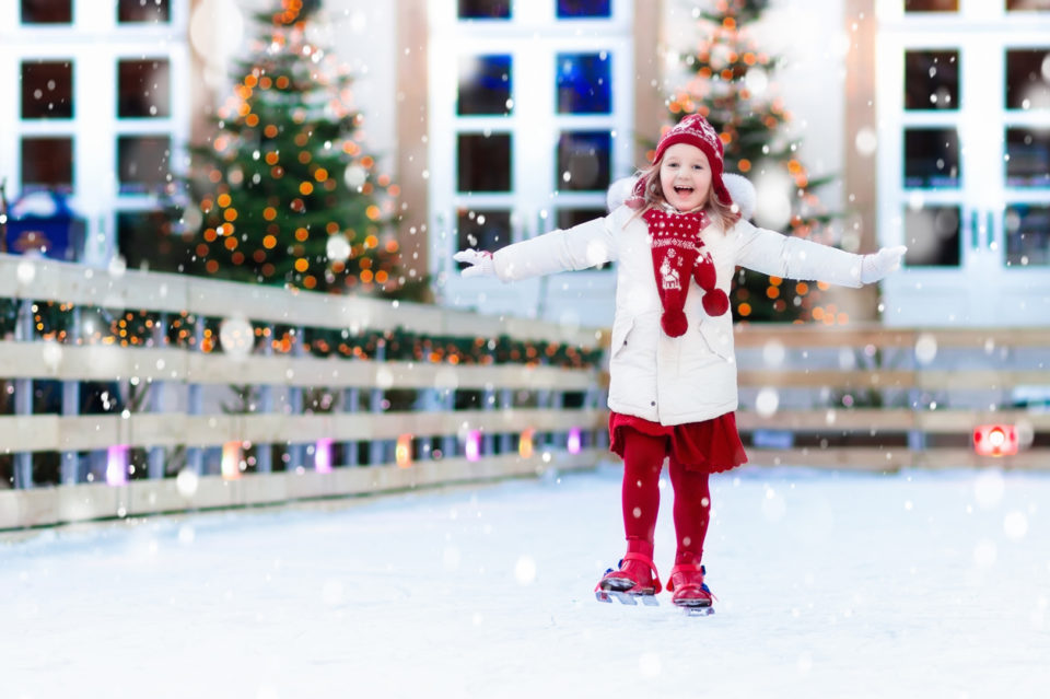 Kids ice skating in winter. Ice skates for child.