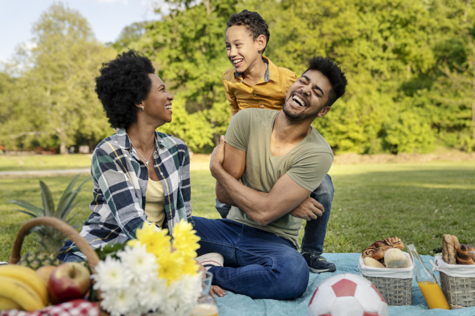 Happy family spending a spring day on picnic