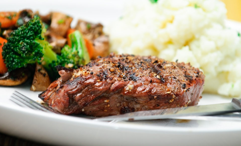 Juicy steak dinner with garlic mashed potatoes, and steamed broccoli