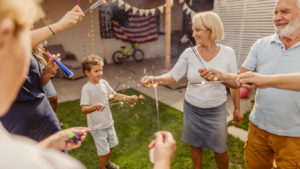 Multigenerational family celebrating Fourth of July