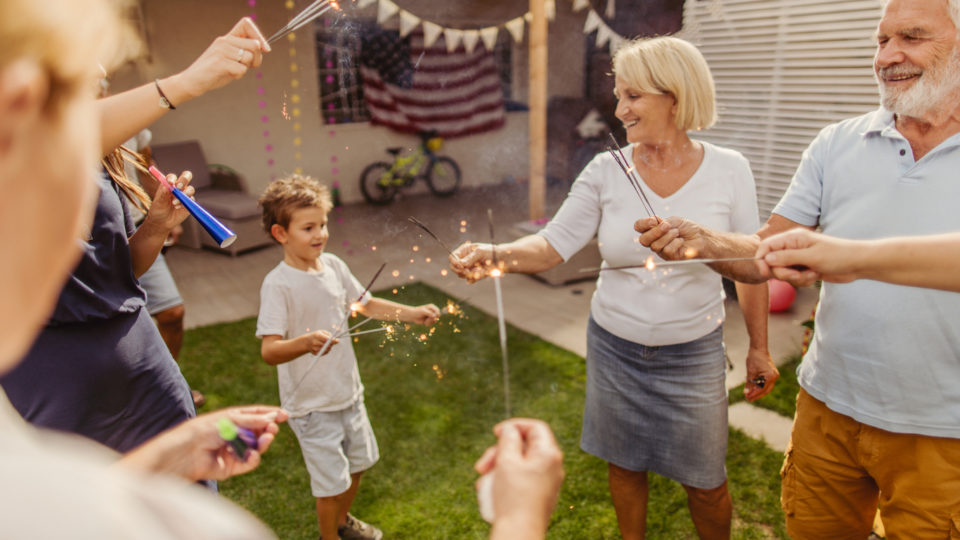 Multigenerational family celebrating Fourth of July